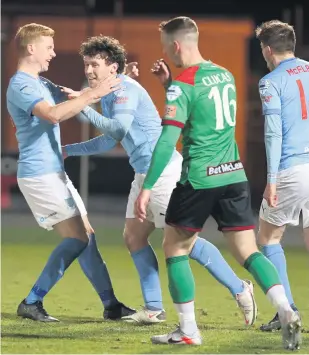  ??  ?? Two good:
Shay Mccartan celebrates after the first of his brace against Glentoran