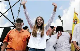  ?? AP/FERNANDO LLANO ?? Fabiana Rosales, wife of Venezuelan Congress President Juan Guaido, an opposition leader who declared himself interim president, greets supporters at a rally Monday demanding the resignatio­n of Venezuelan President Nicolas Maduro in Caracas, Venezuela.