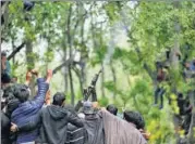  ?? AP FILE ?? A militant fires in the air in salute at the funeral of ‘commander’ Saddam Padder in Heff village, south of Srinagar, on May 6.