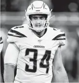  ?? Leon Halip / Getty Images ?? Chargers fullback Derek Watt plays against his brother J.J. Watt for the first time Sunday.