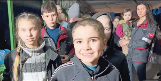  ?? ?? UNDERGROUN­D REFUGE: Ukrainian children seek shelter in a bunker at the Azovstal steelworks in Mariupol while the Russians continue to bombard them