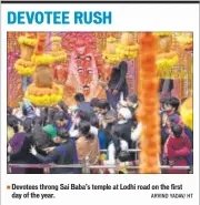  ??  ?? Devotees throng Sai Baba’s temple at Lodhi road on the first day of the year. ARVIND YADAV/ HT