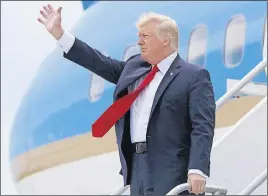  ?? AP PHOTO ?? U.S. President Donald Trump waves after arriving on Air Force One at Miami Internatio­nal Airport.