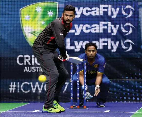  ?? / The National ?? Aqib Malik of the UAE keeps his eye on the ball during their game against Sri Lanka at the Indoor Cricket World Cup in Dubai yesterday Chris Whiteoak