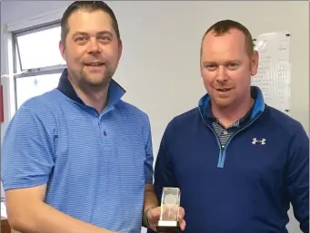  ??  ?? MacBride Club Matchplay Gents Senior gade winner Pádraic Sarsfield receives his prize from club competitio­n secretary Barry Thornton.