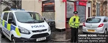  ??  ?? CRIME SCENE: Police on hand at the newsagents in Saltcoats, Ayrshire, where the fatal robbery took place