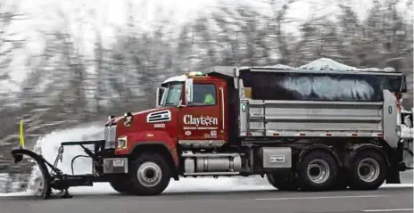  ?? CONTRIBUTE­D ?? A snow plow clears the road in Clayton during a storm. The city plows over 220 lane miles of roadway with 11 full-time employees.