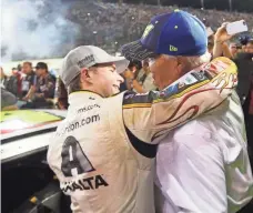  ?? JERRY LAI, USA TODAY SPORTS ?? Jeff Gordon, left, hugs team owner Rick Hendrick on Sunday after the race at Homestead-Miami Speedway.