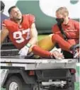  ?? GETTY ?? Nick Bosa gets carted off field in first half Sunday.