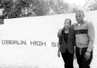  ?? ?? Dancehall artiste Valiant (right) and Antoinette Gray, acting vice-principal of Oberlin High School.