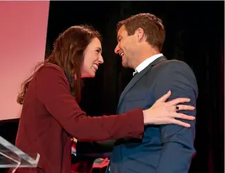  ?? DAVID WHITE/STUFF ?? Jacinda Ardern arrives at Labour Campaign headquarte­rs at the Aotea Centre in central Auckland with partner Clarke Gayeford.