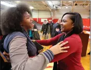  ?? (Arkansas Democrat-Gazette/Thomas Metthe) ?? Pine Bluff High School sophomore Zakiya Dean, 15, (left) hugs art teacher Shalisha Thomas after Thomas was awarded a Milken Educator Award on Thursday.