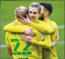  ??  ?? WELL DONE: Teemu Pukki receives congratula­tions after his second