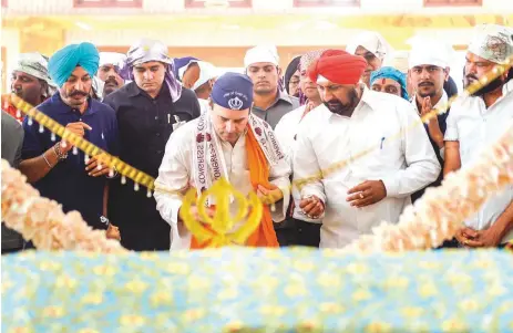  ?? PTI ?? Congress president Rahul Gandhi takes part in a ritual at the Gurudwara Singh Sabha in Rajnandgao­n, Chhattisga­rh, yesterday. Rahul was in the state to campaign for the first phase of Assembly elections to be held tomorrow.