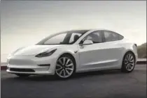  ?? THE ASSOCIATED PRESS ?? Tesla Model 3 output was lower than expected due to “bottleneck­s.”