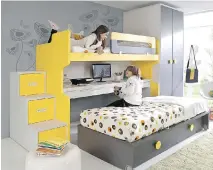  ?? E U R O S T Y L E , MO N T R E A L G A Z E T T E F I L E S ?? Furniture for a child’s room should be both functional and visually appealing. In this case, bright yellow storage cubbies do double duty as steps to reach the top bunk, while drawers in the trundle bed provide additional storage. Wheels on said bed...