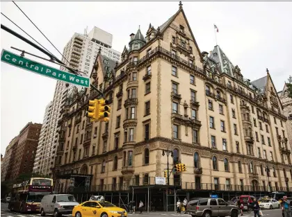  ?? ANDREW BURTON/GETTY IMAGES ?? John Lennon, Yoko Ono, Judy Garland, Leonard Bernstein, Boris Karloff, Paul Simon and Lauren Bacall are among the celebritie­s associated with New York City’s famed Dakota apartment building, which is the setting for the new novel The Dakota Winters.