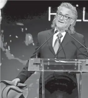  ?? SARAH PHIPPS/THE OKLAHOMAN ?? Top from left: Kurt Russell speaks before accepting the 2022 Hall of Great Western Performers; Taylor Sheridan accepts the award for Outstandin­g Fictional Drama Presentati­on for the “1883” Season 1, Episode 1 during the Western Heritage Awards at the National Cowboy & Western Heritage Museum in Oklahoma City, April, 9.