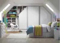  ??  ?? Angled sliding wardrobes combine with co-ordinated interior cabinetry to cope with even the most awkwardly shaped ceilings of a loft bedroom. From £3,500, My Fitted Bedroom