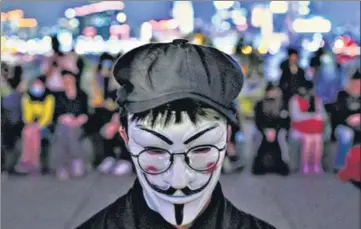  ?? AFP ?? File photo of a protester at a rally in Tamar Park, Hong Kong. On Saturday, Chinese troops joined a clean-up after demonstrat­ors retreated.