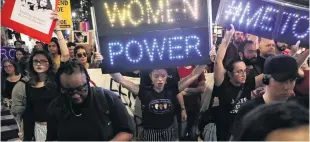  ?? PHOTO: REUTERS ?? Demonstrat­ors hold signs during a protest and march against US Supreme Court nominee Brett Kavanaugh in New York City, on Monday.