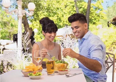  ?? COURTESY OF SANTA FE COUNTY ?? Visitors to Rancho de Chimayó enjoy a meal.