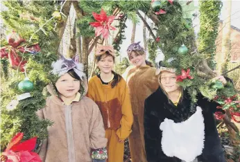  ?? ?? Year 6 Pupils, from left, Cora, Katie, Amelia, and Sophie dressed as characters from the book Mouse’s Christmas.