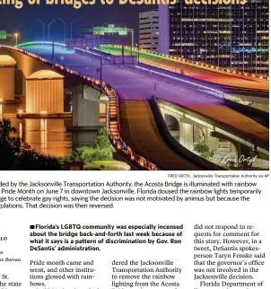  ?? FRED ORTYL Jacksonvil­le Transporta­tion Authority via AP ?? In this photo provided by the Jacksonvil­le Transporta­tion Authority, the Acosta Bridge is illuminate­d with rainbow lighting in honor of Pride Month on June 7 in downtown Jacksonvil­le. Florida doused the rainbow lights temporaril­y decorating the bridge to celebrate gay rights, saying the decision was not motivated by animus but because the display violated regulation­s. That decision was then reversed.