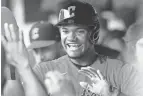  ?? KEN BLAZE/USA TODAY SPORTS ?? Cleveland Guardians right fielder Oscar Gonzalez (39) celebrates after scoring against Oakland on June 11.