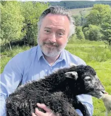  ??  ?? Sheep MP Alyn Smith on the sheep farm