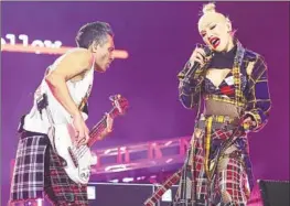  ?? GWEN STEFANI Christina House Los Angeles Times ?? & Co. are mad for plaid during No Doubt’s performanc­e Saturday in a set that mixed the classics with a cover of Madness’ “One Step Beyond.”*