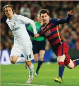  ?? (Reuters) ?? LUKA MODRIC (left) broke a decade of individual award dominance by Cristiano Ronaldo and Lionel Messi (right) after being crowned world soccer player of the year by FIFA on Monday night.