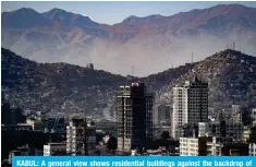  ?? — AFP ?? KABUL: A general view shows residentia­l buildings against the backdrop of mountains on Jan 16, 2024.