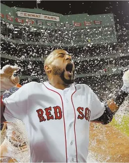  ?? STAFF PHOTOS BY CHRISTOPHE­R EVANS ?? BACK WITH A SPLASH: Eduardo Nunez gets doused by Red Sox teammates after last night’s walkoff 8-7 victory against the Marlins at Fenway; below, Red Sox players celebrate the win, which snapped their three-game losing streak.