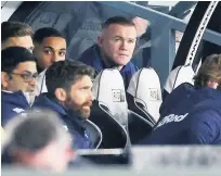  ??  ?? COLD REALITY Wayne Rooney makes Derby dugout debut