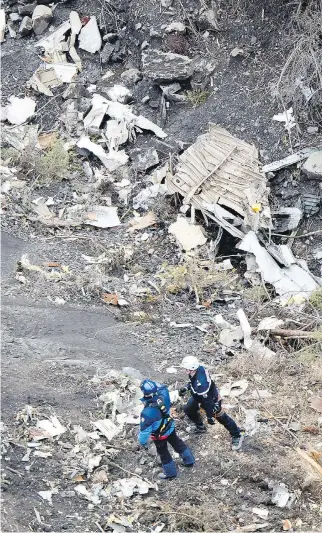  ?? FA B R I C E BA L S A MO, G E N D A R ME R I E NAT I O NA L E / A P ?? Rescue workers at the crash site near Seyne- les- Alpes, French Alps, on Wednesday. Investigat­ors have opened a damaged black box from the Germanwing­s plane.