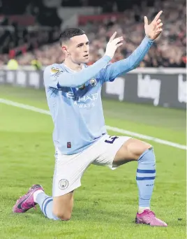  ?? Picture: Getty Images ?? MARKSMAN. Manchester City’s Phil Foden celebrates after scoring a goal during their English Premier League match against Brentford at Brentford Community Stadium on Monday night.