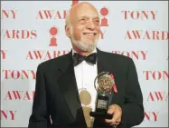  ?? RICHARD DREW — THE ASSOCIATED PRESS FILE ?? Harold Prince holds his Tony award for best director in a musical for “Show Boat,” at Broadway’s Minskoff Theater in New York. Prince, who pushed the boundaries of musical theater with such groundbrea­king shows as “The Phantom of the Oepra,” “Cabaret,” “Company” and “Sweeney Todd” and won a staggering 21 Tony Awards, died Wednesday after a brief illness in Reykjavik, Iceland. He was 91.