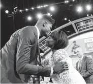  ?? Mike Lawrie / Getty Images ?? Texas’ Mo Bamba celebrates with his mother after being drafted sixth overall by the Orlando Magic.