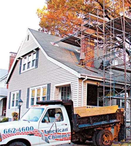  ?? TIM CARTER ?? As this scaffoldin­g shows, chimney repair is a job that requires experience and know-how.