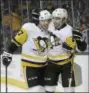 ?? JEFF CHIU — THE ASSOCIATED PRESS ?? In this Jan. 20, 2018, file photo, Pittsburgh Penguins center Sidney Crosby , left, and left wing Conor Sheary celebrate after Sheary scored a goal against the San Jose Sharks during the first period of an NHL hockey game in San Jose, Calif.