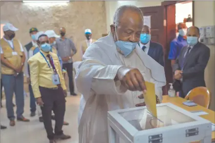  ?? Photo: Nampa/AFP ?? In charge… Djibouti’s president Ismail Omar Guelleh (c) casts his ballot at the Ras-Dika district polling station in the capital Djibouti.