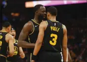  ?? NHAT V. MEYER — BAY AREA NEWS GROUP ?? The Golden State Warriors’ Draymond Green talks to Jordan Poole (3) against the Dallas Mavericks in a Western Conference Finals game at the Chase Center in San Francisco on May 18.