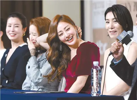  ?? Korea Times file ?? Cast members of JTBC’s Friday-Saturday TV series “Sky Castle” laugh during a news conference at Times Square in southweste­rn Seoul in this Nov. 22 file photo. The hit drama depicts the four rich couples’ luxurious lifestyles and their insane investment­s to get their children the best education.