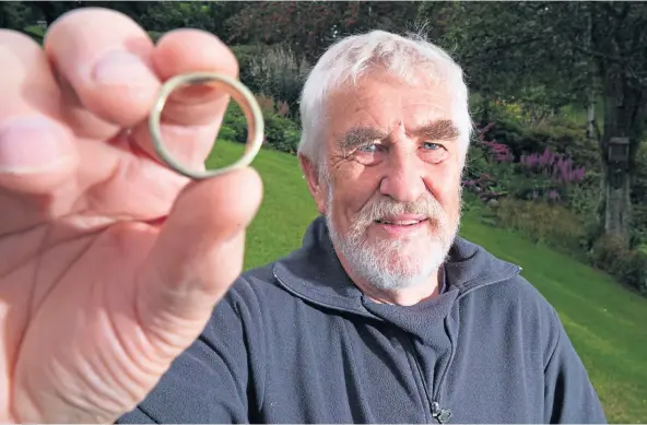  ??  ?? PRECIOUS GIFT: Alan Souter, from Aberlour, with one of the rings he commission­ed a goldsmith to make for his wife, Colinne.