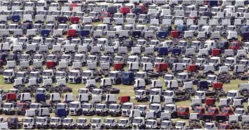  ?? — Reuters ?? New Ford trucks are seen at a parking lot of the Ford factory in Sao Bernardo do Campo, Brazil.