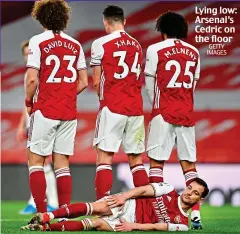  ?? GETTY IMAGES ?? Lying low: Arsenal’s Cedric on the floor