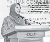  ??  ?? NORZAWIYAH menyampaik­an ucapan aluannya pada Majlis Perjumpaan Menteri Bersama Warga KKMM.