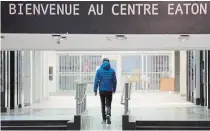  ?? GRAHAM HUGHES THE CANADIAN PRESS ?? A man walks through a mostly empty shopping mall in downtown Montreal on Sunday.