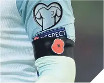  ??  ?? England defied FIFA to wear poppies against Scotland on Friday night.